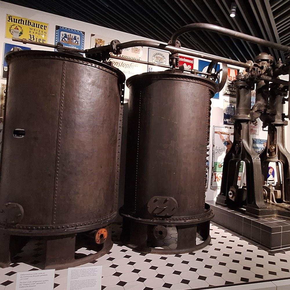 Two large industrial tanks and an engine.